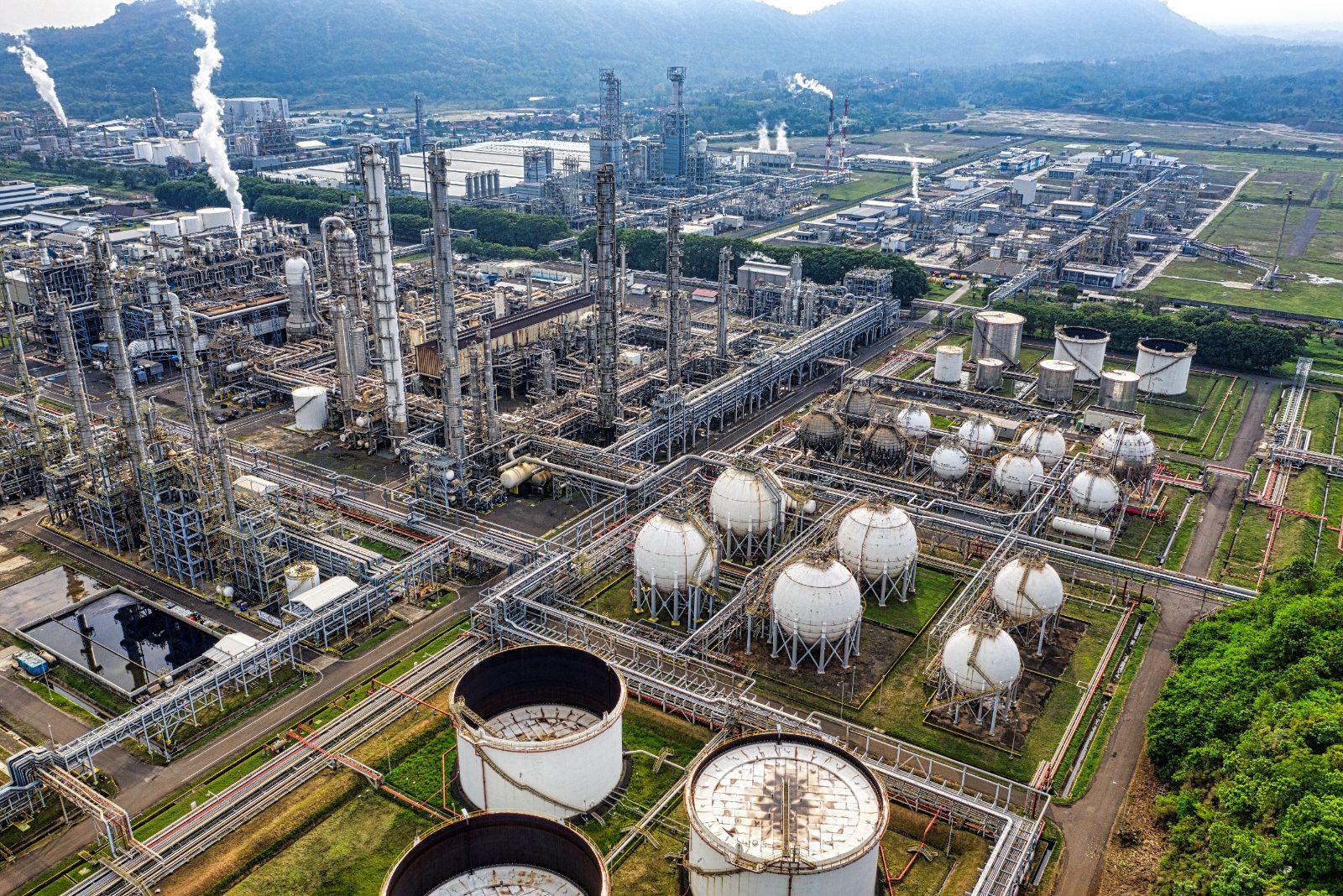 Aerial view of a petrochemical complex with storage spheres and towers